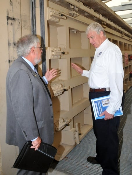 Edgar L. Tucker, Senior VP of Texas Medical Center (left) and FEMA Deputy Administrator Rich Serino (right) discuss a Presray D5B Sliding Flood Door installed at street level to prevent future flooding. Source: FEMA / Earl Armstrong 2012.